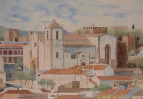 casas, igreja e torres de castelo ao fundo