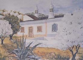 Casas típicas e amendoeiras floridas